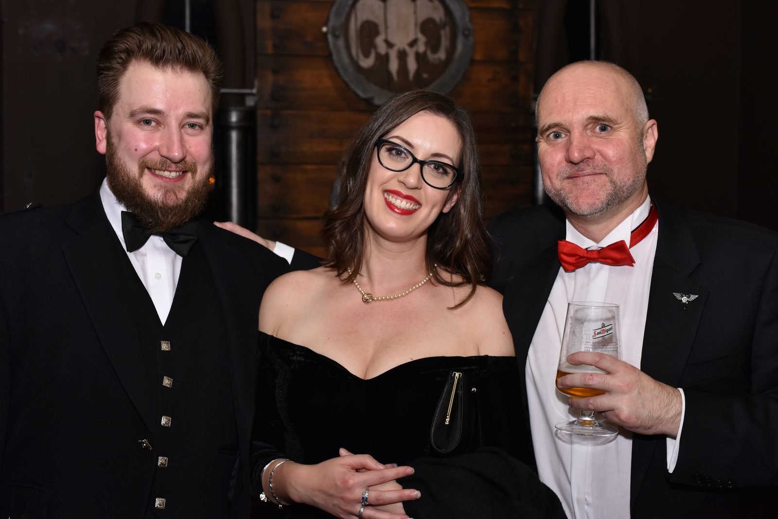 Black-tie group portrait at company gala