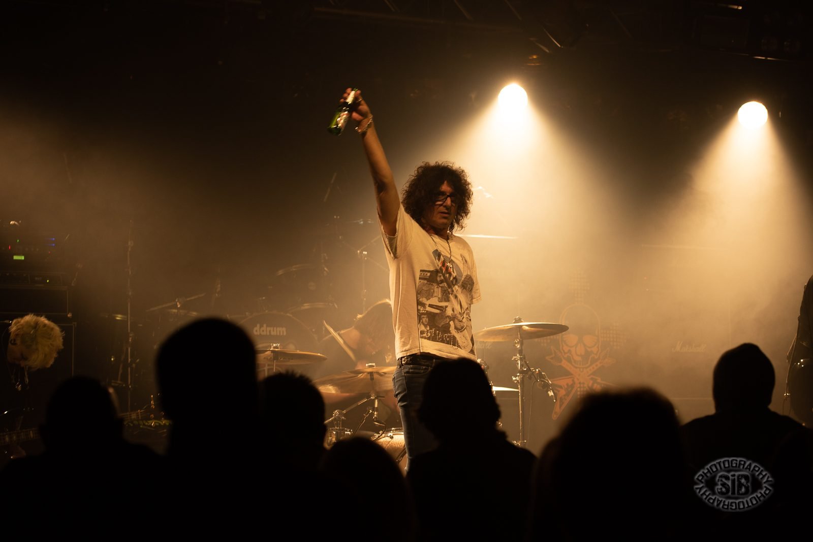 Full band, wide stage shot