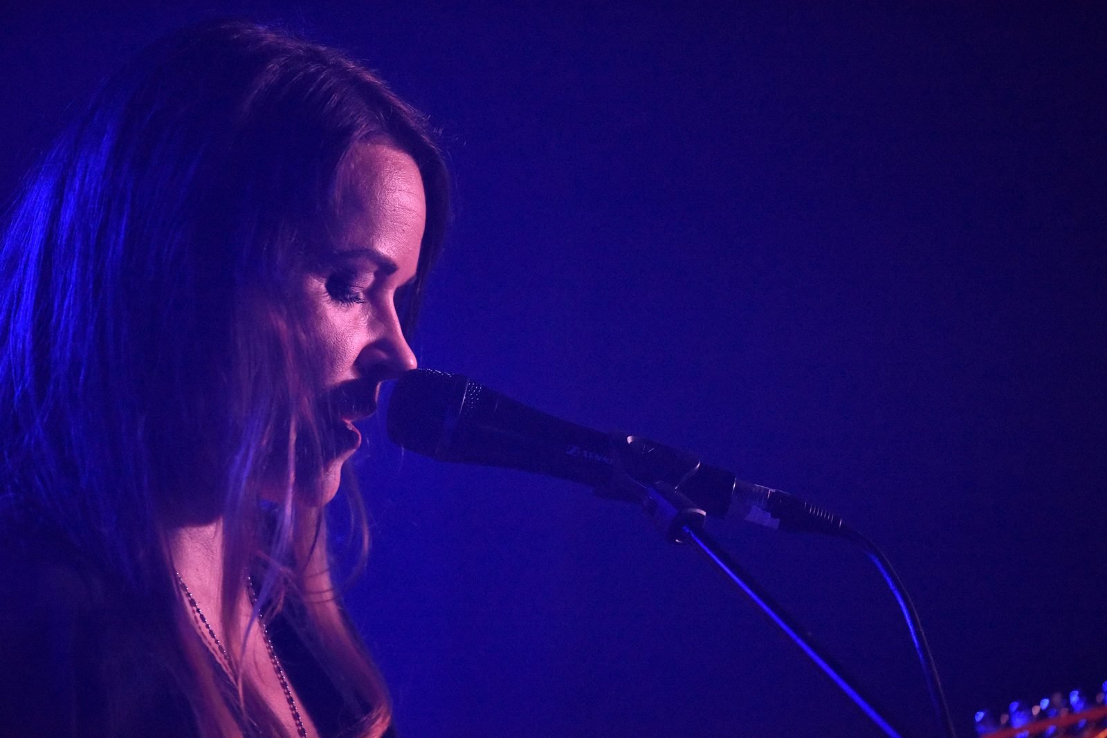 Performer in low light, close up